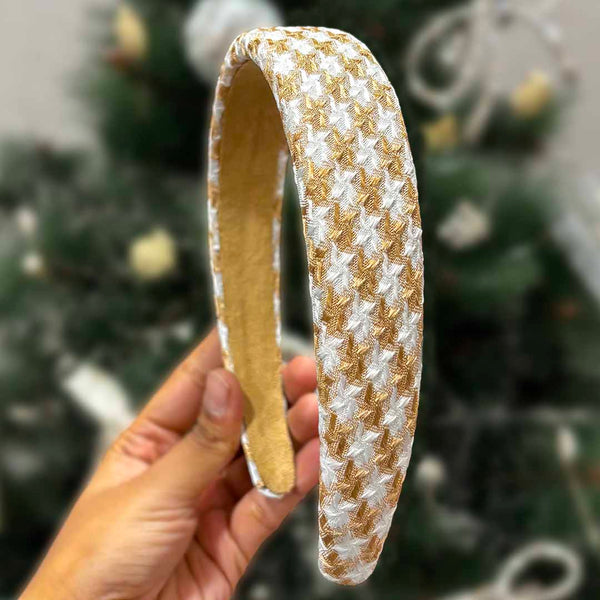 A brown houndstooth puff hair band with a heart charm, branded with 'Hair Drama Co. Emily in Paris'.