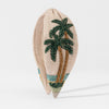 Hand-beaded tropical headband with emerald palm trees and gold sequin sand on beige linen base