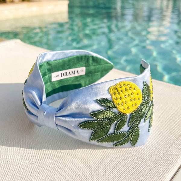 Embellished lemon headband with hand-beaded citrus motifs and green embroidery on sky-blue satin