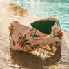 Hand-embroidered tropical headband with beaded palm trees - handcrafted details on soft beige satin