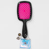 Black hairbrush with pink bristle head and decorative charm on a white background