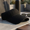 Effortlessly glam ribbed visor with oversized shades and beachy waves - on-holiday sun cap