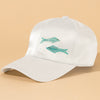Resort-inspired white baseball cap adorned with embroidered sardines and ocean charm