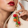 Fruit-themed bag charm with glossy beaded details and metal loop for bags, hats and keys