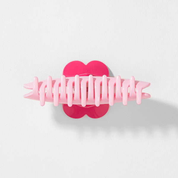 Pink hair clip with heart design on a white background