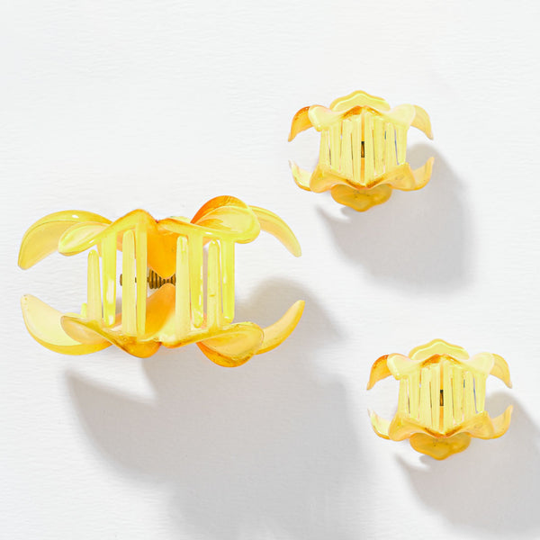 Yellow floral earrings on a white background