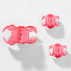 Set of three pink floral hair clips on a white background