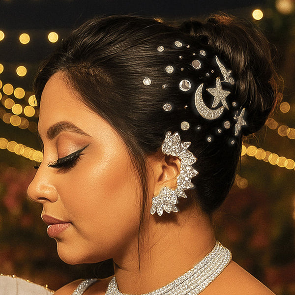 Woman with intricate hairpiece and jewelry against a blurred bokeh background