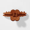 Brown plastic clip on a white background