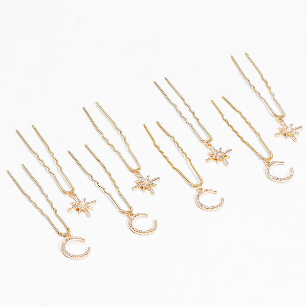 Delicate gold star moon pins scattered through soft updo hairstyle for sufi night celebration