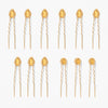 Crystal U-pins in warm yellow and cool silver stacked together for maximum hair sparkle