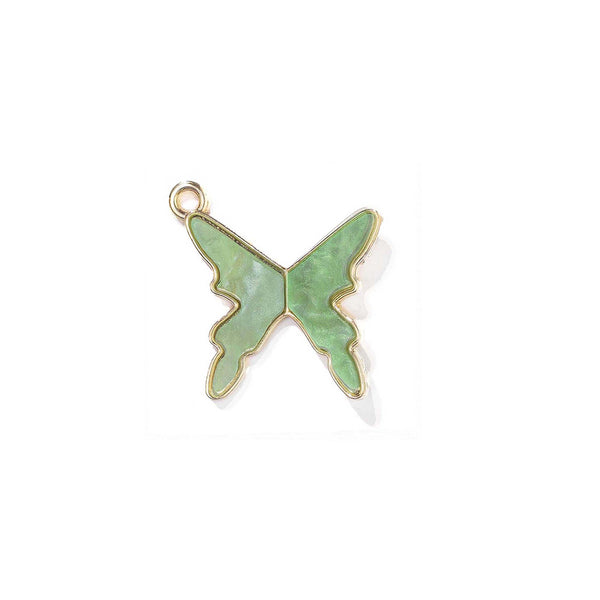 Green butterfly-shaped pendant with gold outline on a white background