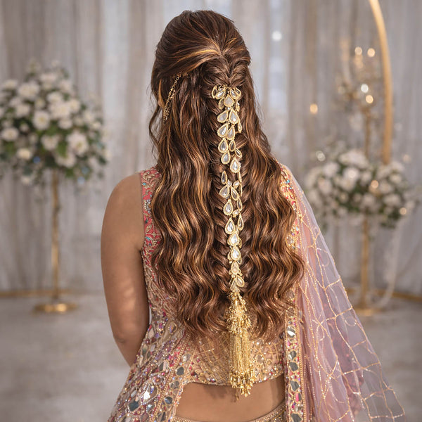 Woman with elaborate hairpiece and traditional outfit in a decorated indoor setting