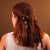 Brown crochet headscarf with shell charms styled as boho hair wrap for beach days