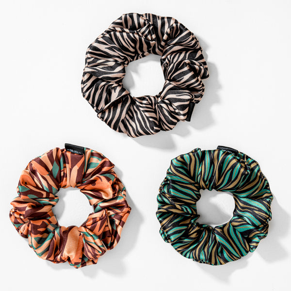 Three patterned scrunchies on a white background