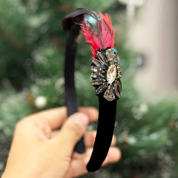 HAIRBAND EMBELLISHED WITH BROACH AND RED & BLACK FEATHER