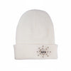 White beanie with decorative emblem on a white background