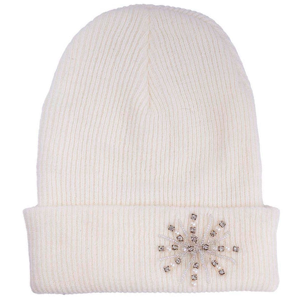 White beanie with decorative emblem on a white background