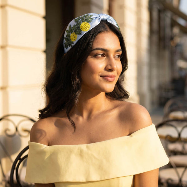 Citrus-inspired knotted headband with hand-beaded lemons for summer styling and beach vacations
