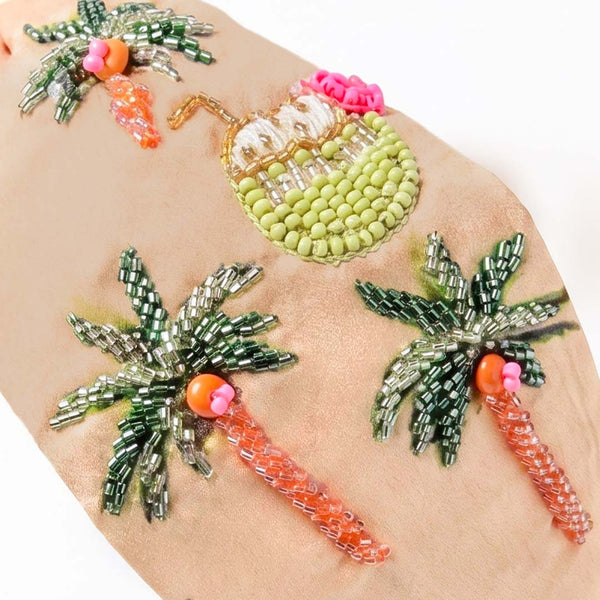 Knotted embroidered tropical headband with beaded palm trees and velvet interior