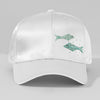 White cap with green fish designs on a gray background