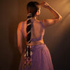Colourful bridal parandi with tassels, pearls and crystals woven through a sleek braid