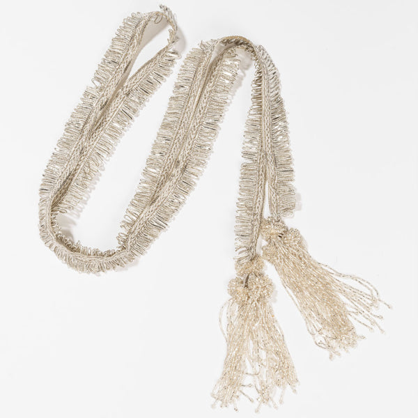 Statement bridal parandi in silver with intricate lace, beadwork, and cascading tassels