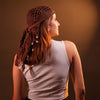 Crochet headscarf in warm brown with shell charms, worn as boho bandana hair accessory