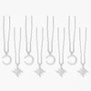 Sparkly star and moon U pins holding festival braid together with subtle celestial hair vibes